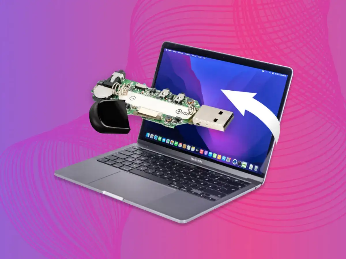 Odkryj, jak znalezc pendrive na MacBooku. Rozłożony pendrive wychodzi z ekranu laptopa, sugerując rozwiązanie problemu.